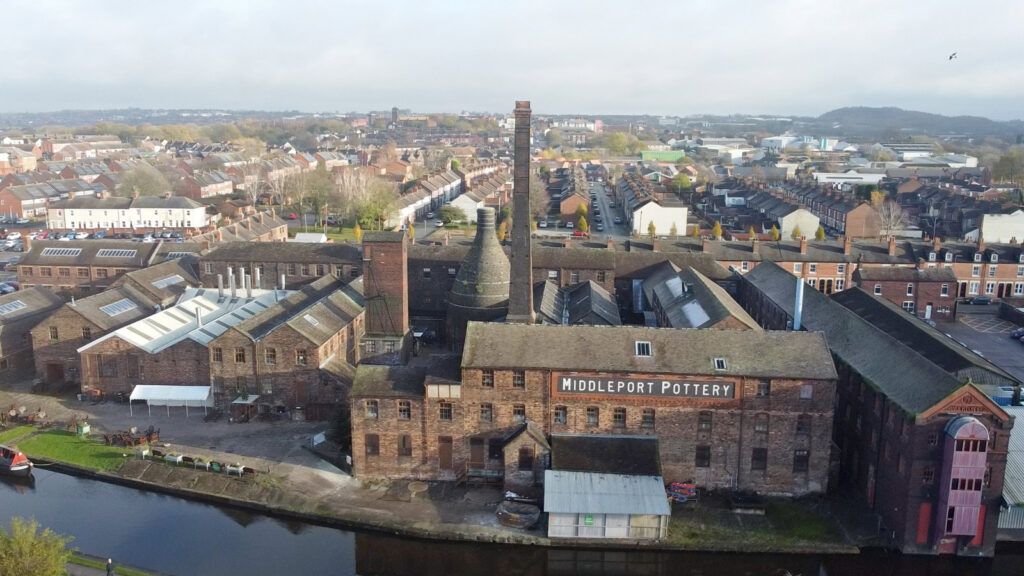 An image of Middleport Pottery from the air, a large red brick building with a tall chimney stack.