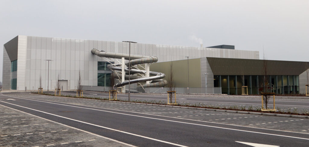 A picture of Moorways Stadium and Sports Complex from the outside, with a water slide visible.