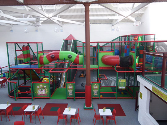 An image of the play shed - a multi-level play area with nets, slides and tunnels.