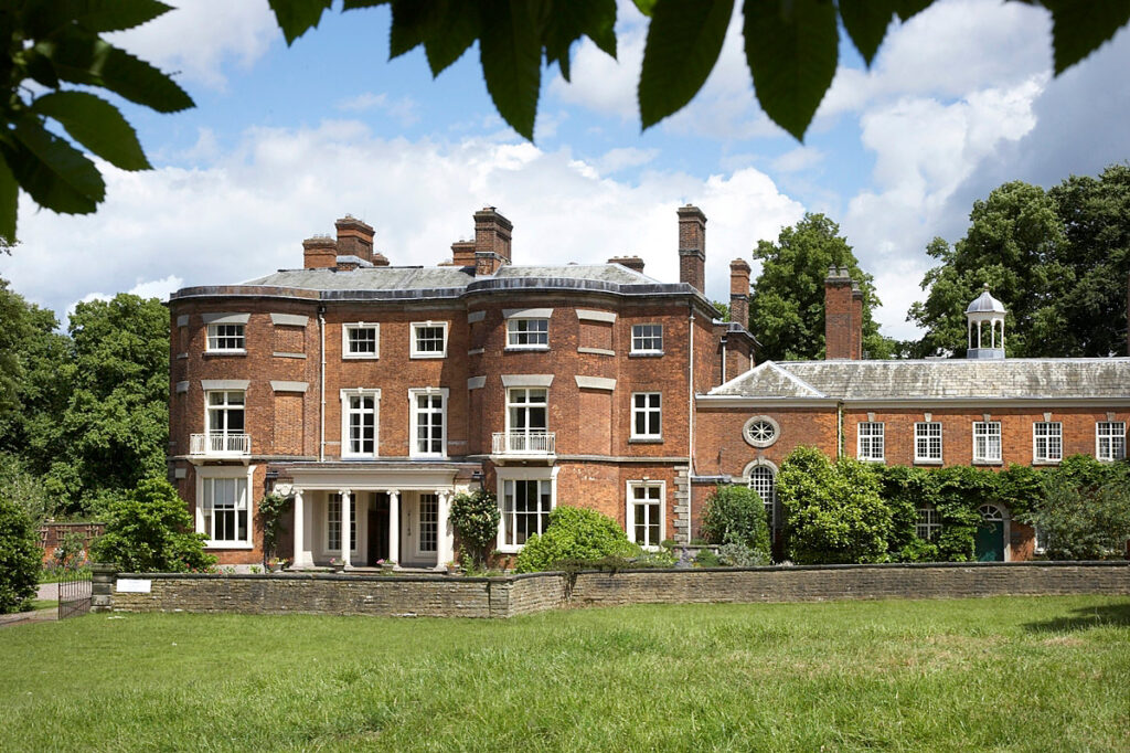 An exterior photograph of Rode Hall from across the lawn.