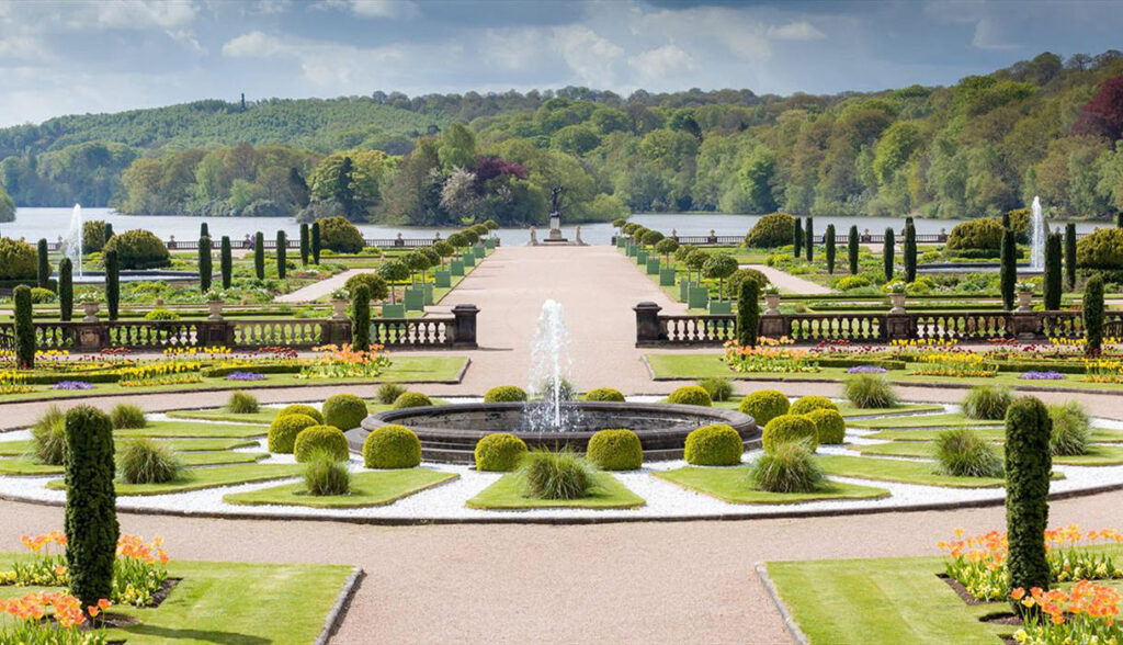 An image of the sprawling and beautifully maintained trentham gardens, featuring open water, fountains and symmetrical gardens.