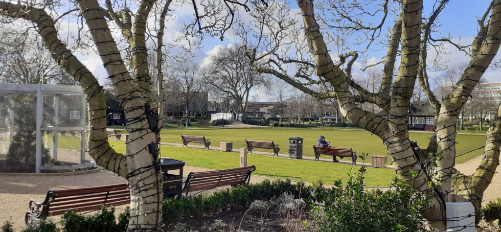 Victoria Park - an open, grassy space in Stafford, surrounded by benches.