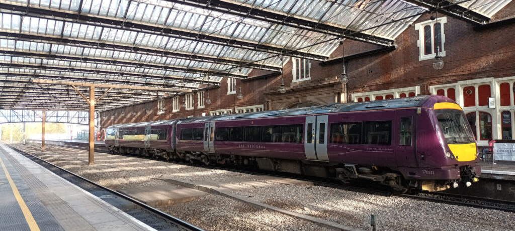 North Staffordshire Community Rail Partnership (NSCRP) primary homepage image - A purple East Midlands Railway (EMR) Train sitting idle at Stoke-on-Trent Station