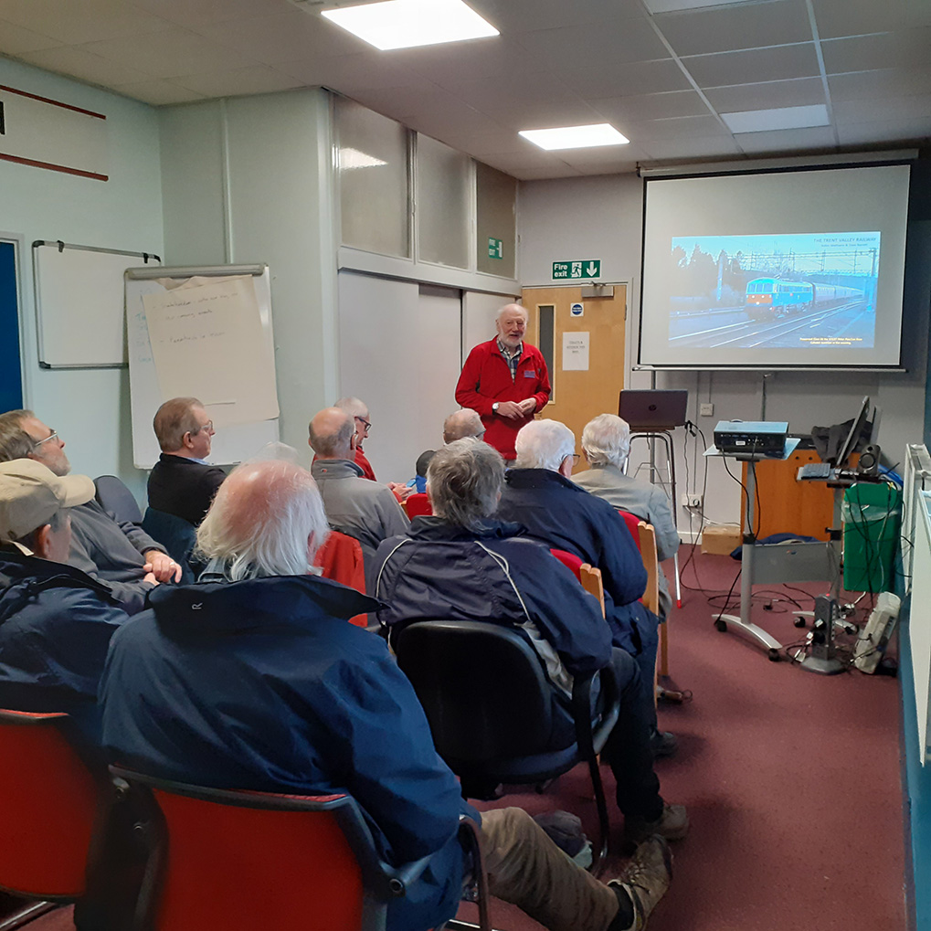 Picture showing Robin Mathams and Dave Barrett giving a talk to a group about the 175th anniversary of the Trent Valley Line.