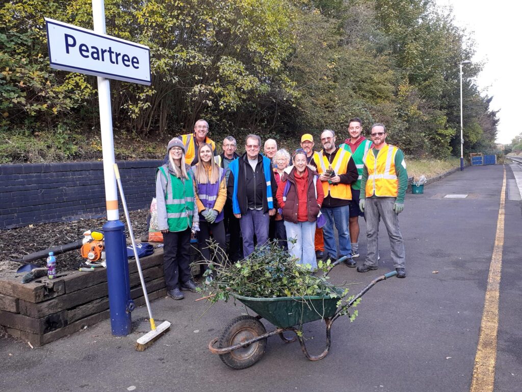A group of station volunteers standing on the platform at Peartree station. Contact NSCRP.