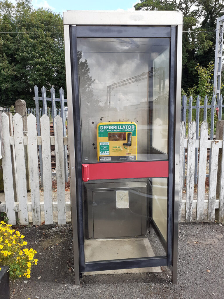 The new defibrillator installed in an old phone box at Stone Station