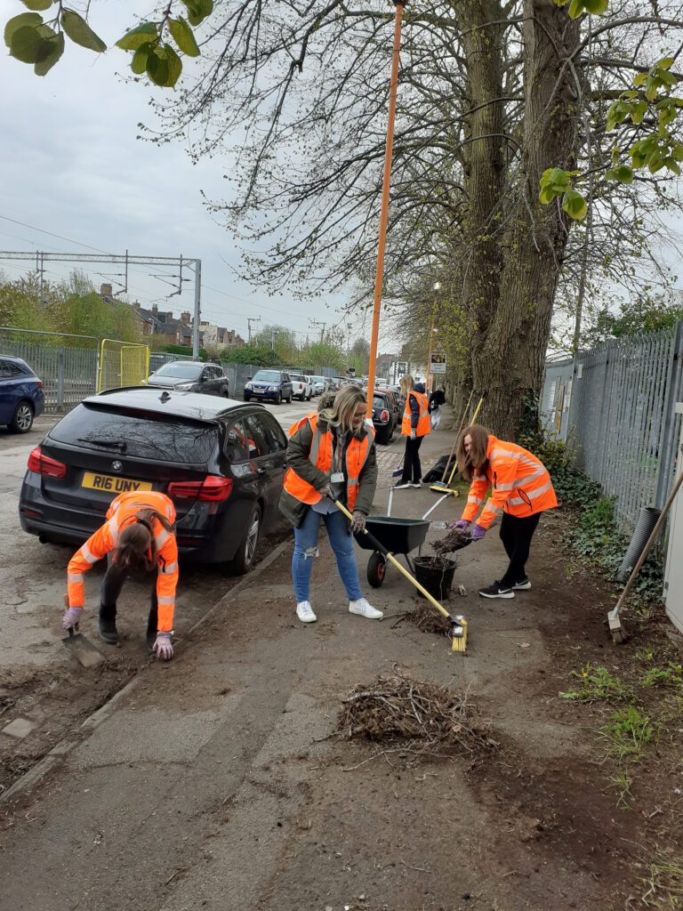 A group of volunteers hard at work clearing Station Approach