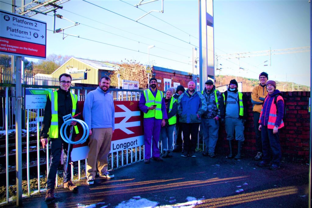 A group of volunteers tired but happy at the end of a snowy litter pick